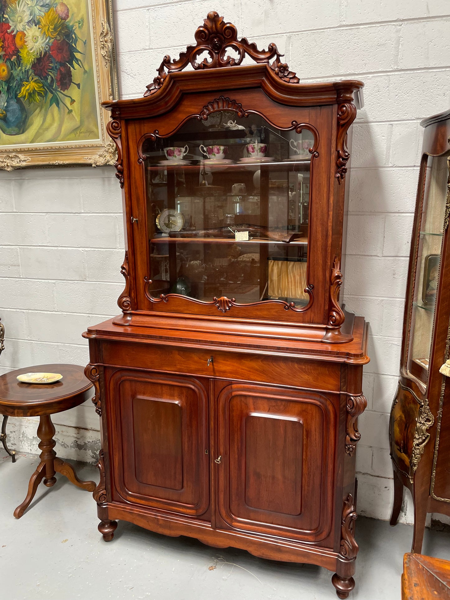Outstanding French Mahogany sideboard of good small proportions. It has a lovely display area at the top and hidden storage at the bottom. In good restored condition. Circa 1860.