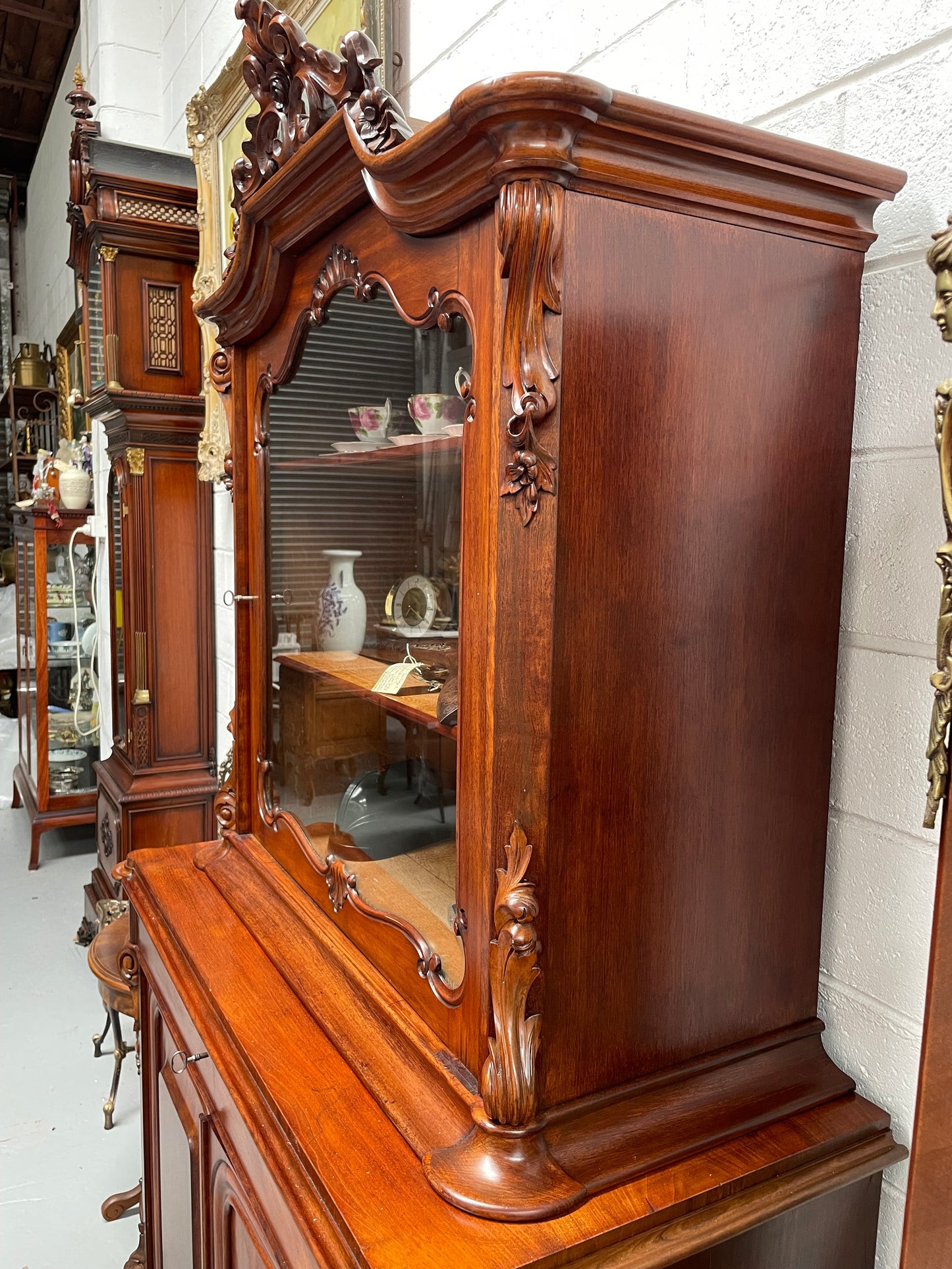 Outstanding French Mahogany sideboard of good small proportions. It has a lovely display area at the top and hidden storage at the bottom. In good restored condition. Circa 1860.