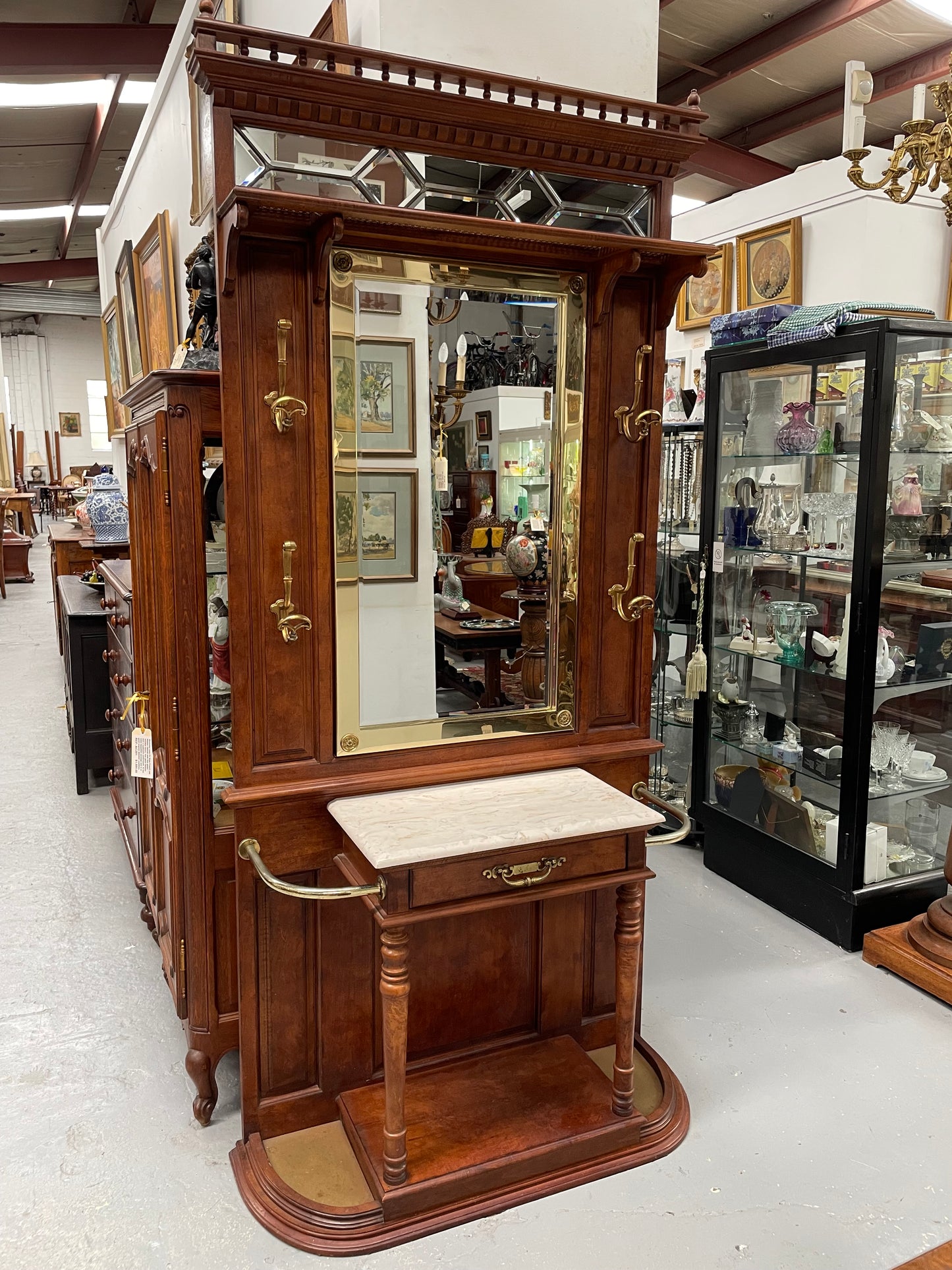 Outstanding quality custom made vintage French style hallstand. It features four decorative hanging hooks, a practical white marble top and a drawer for added storage. In good original condition and has been sourced locally.