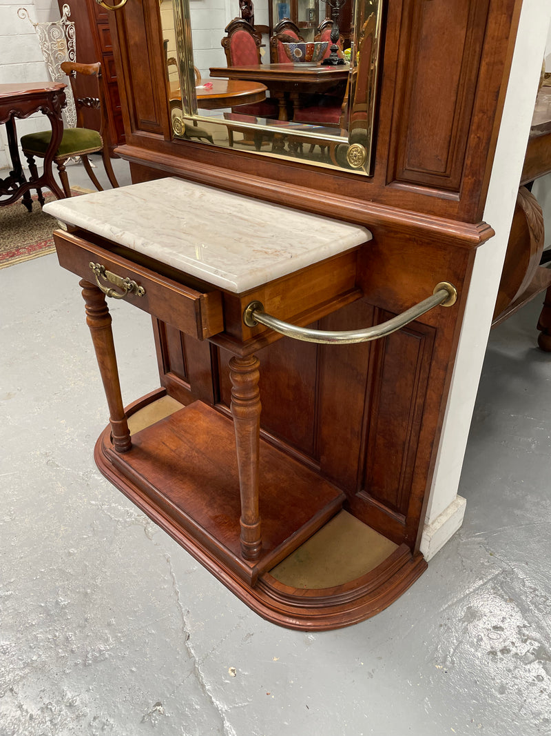 Outstanding quality custom made vintage French style hallstand. It features four decorative hanging hooks, a practical white marble top and a drawer for added storage. In good original condition and has been sourced locally.