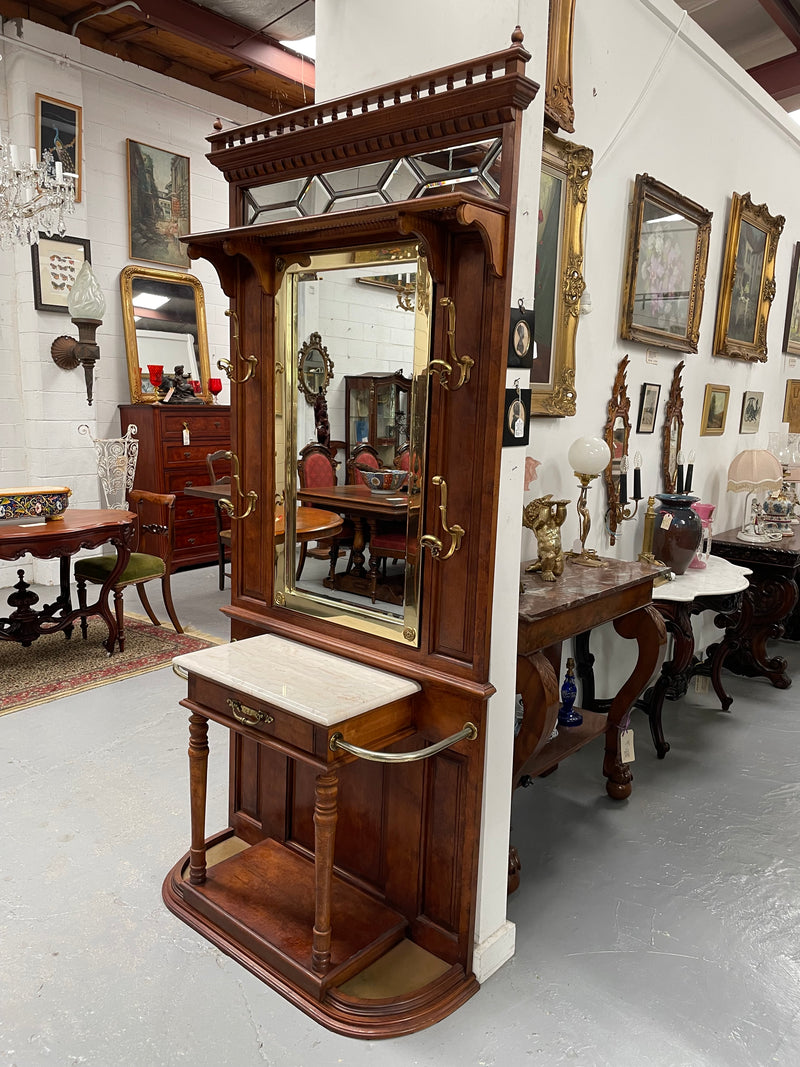 Outstanding quality custom made vintage French style hallstand. It features four decorative hanging hooks, a practical white marble top and a drawer for added storage. In good original condition and has been sourced locally.