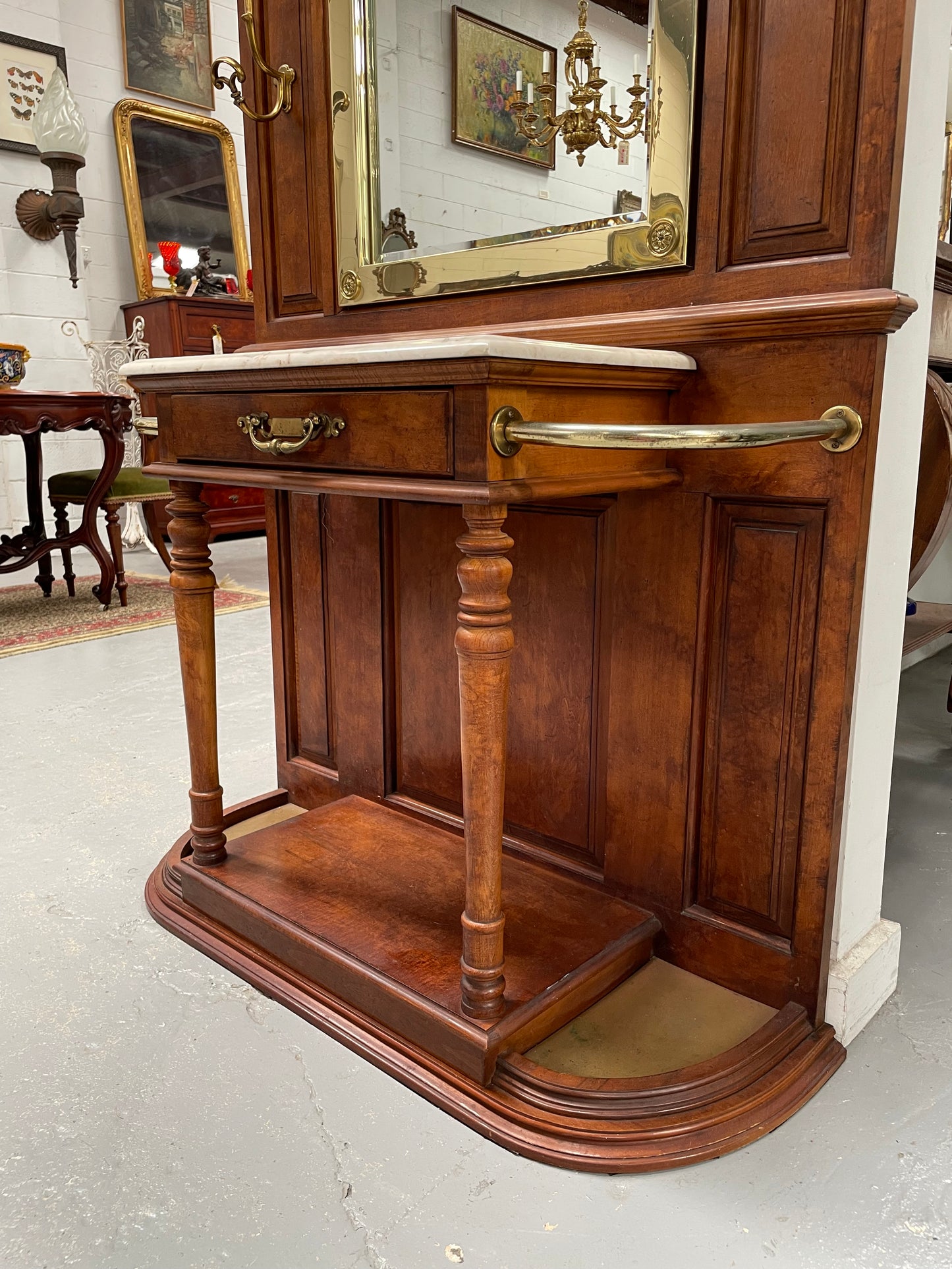 Outstanding quality custom made vintage French style hallstand. It features four decorative hanging hooks, a practical white marble top and a drawer for added storage. In good original condition and has been sourced locally.