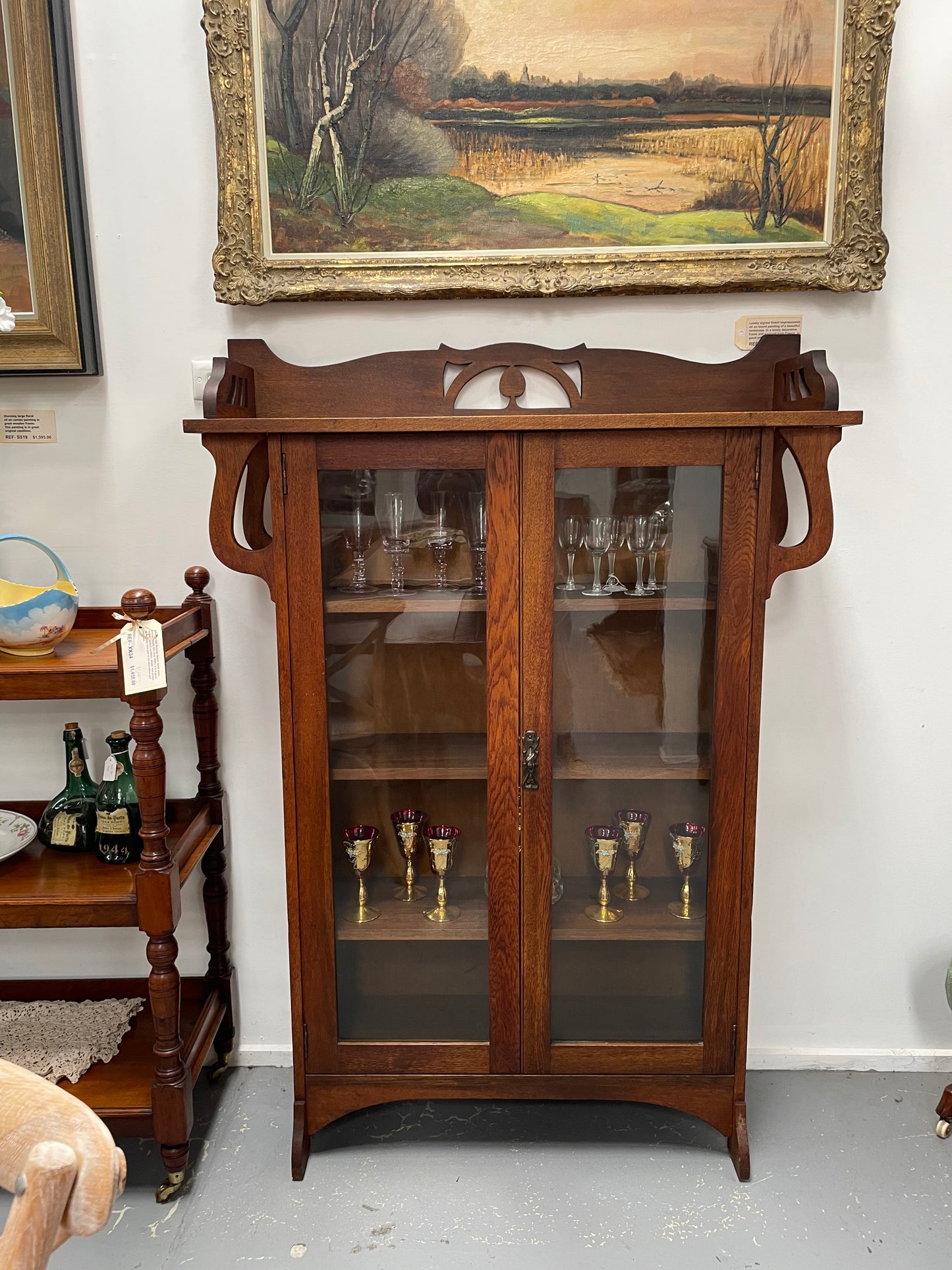 Art Nouveau solid Oak bookcase with three fixed shelves. Could also be used as a display cabinet. Sourced locally and in good original condition.