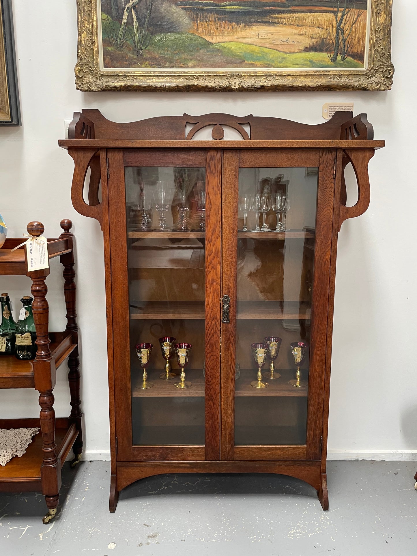 Art Nouveau solid Oak bookcase with three fixed shelves. Could also be used as a display cabinet. Sourced locally and in good original condition.