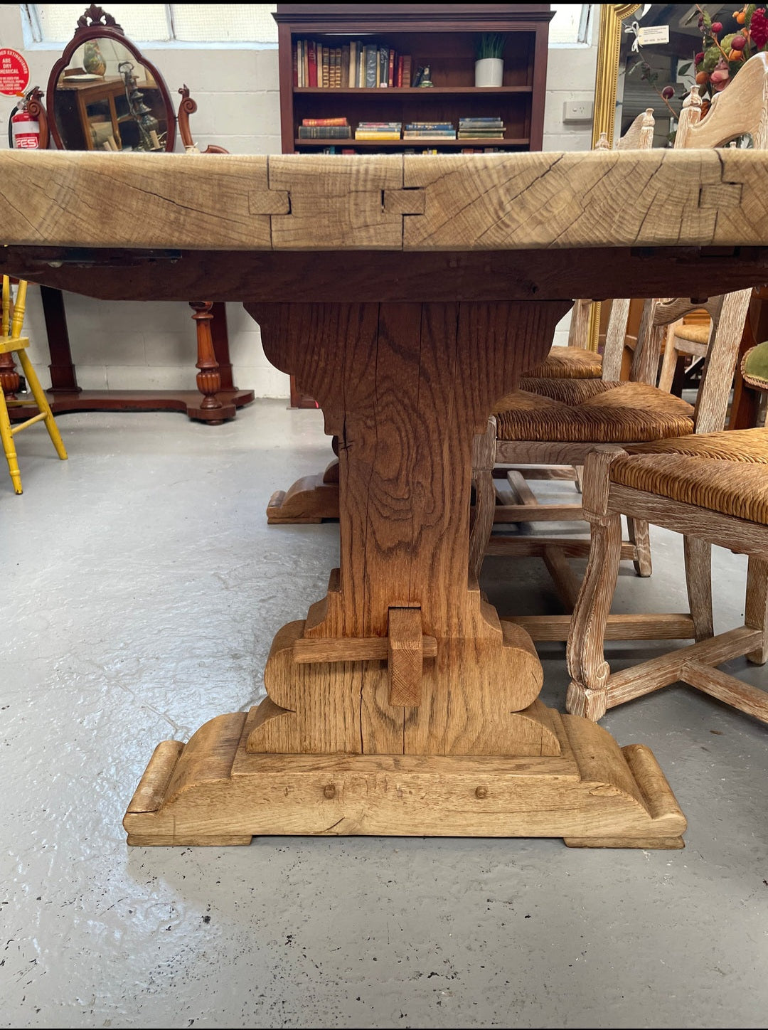 Sourced from France a raw French Oak pedestal dining table. This stunning table features raw oak timber that could be used as is for a distressed look, or finished and waxed for a more refined look. It is in good solid original condition.
