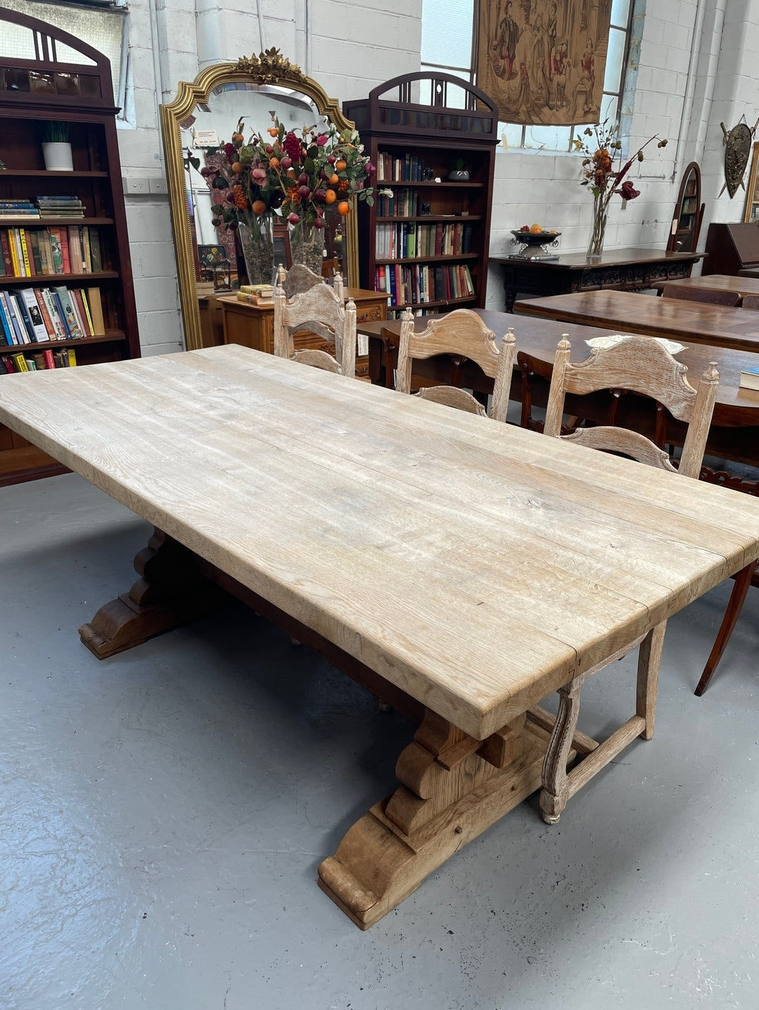 Sourced from France a raw French Oak pedestal dining table. This stunning table features raw oak timber that could be used as is for a distressed look, or finished and waxed for a more refined look. It is in good solid original condition.