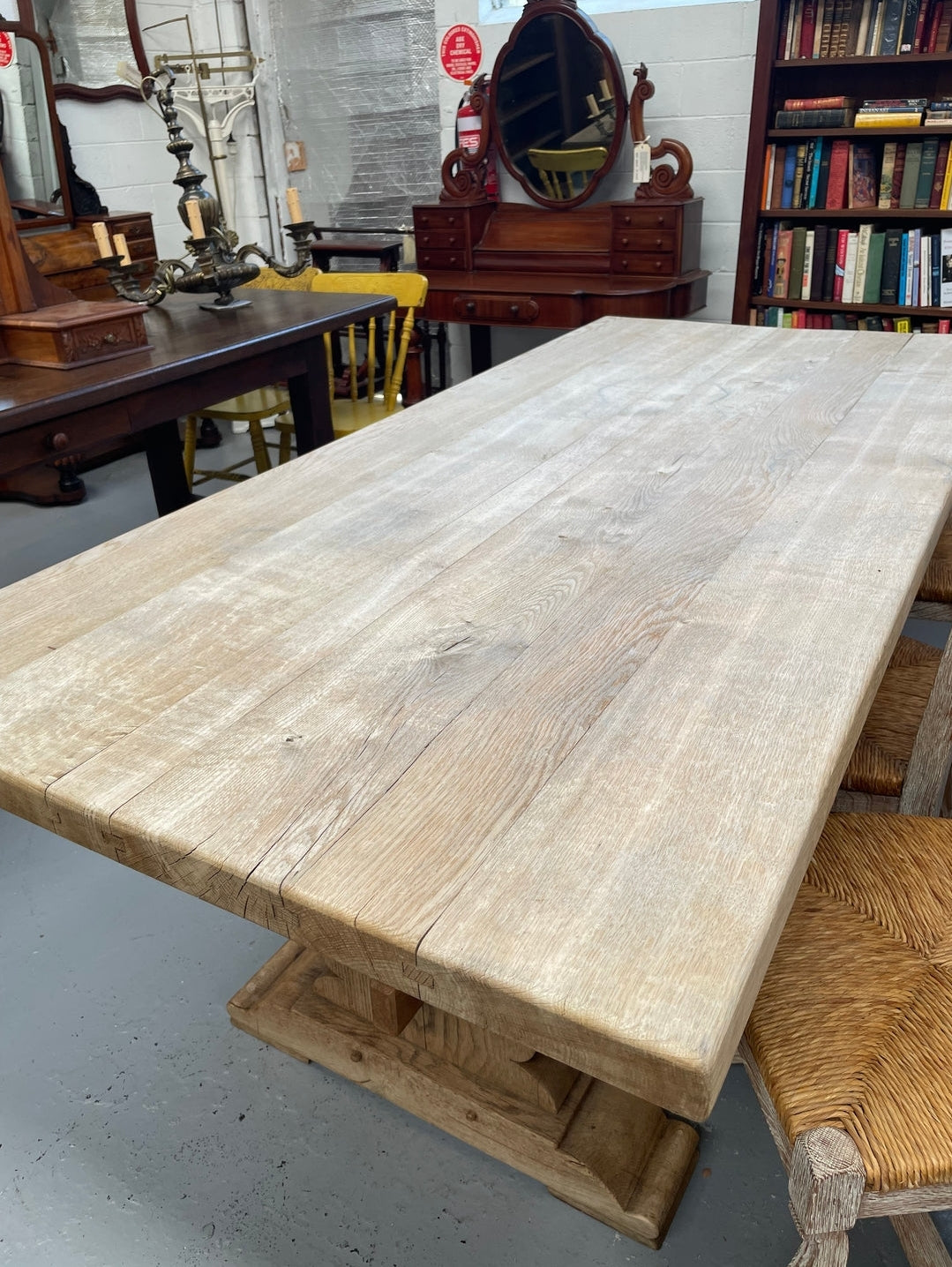 Sourced from France a raw French Oak pedestal dining table. This stunning table features raw oak timber that could be used as is for a distressed look, or finished and waxed for a more refined look. It is in good solid original condition.