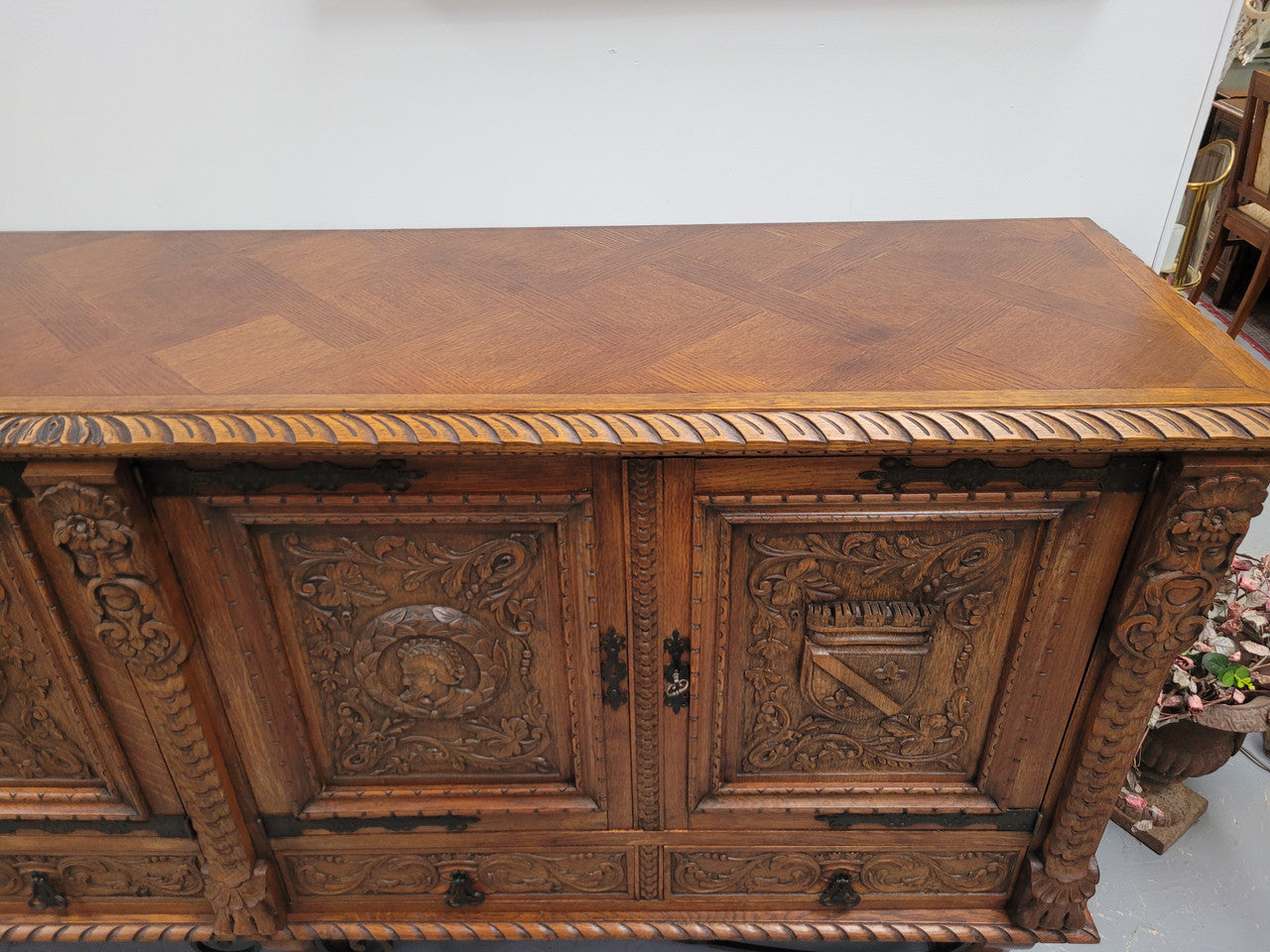 Large French Oak Renaissance style four door sideboard/buffet. Great decorative item with amazing carvings and stunning iron work on base. It is in good original detailed condition. Can pull apart completely making it easier to move.
