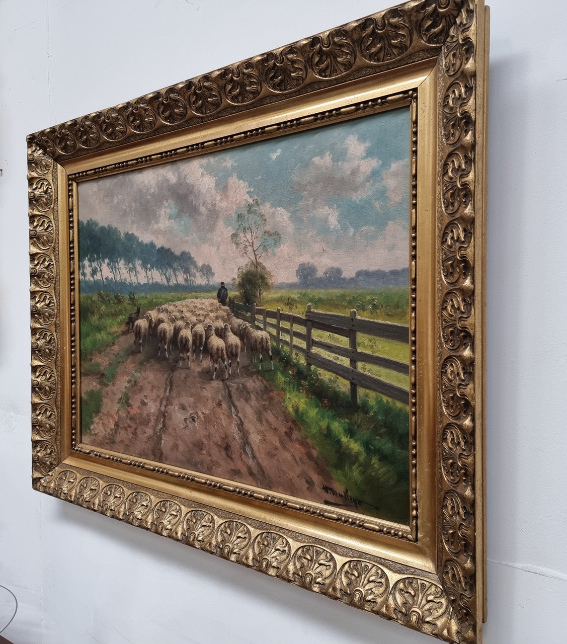 Sourced in France is this beautiful  oil painting on canvas of sheep on  a country farm and framed in a ornate gilt frame. In good original condition.