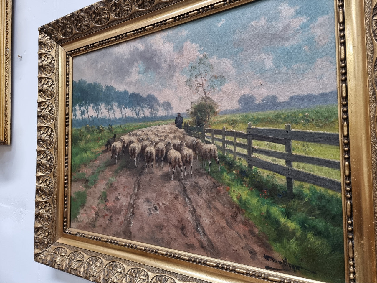 Sourced in France is this beautiful oil painting on canvas of sheep on a country farm and framed in a ornate gilt frame. In good original condition.