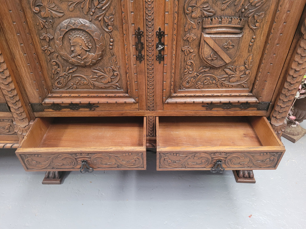 Large French Oak Renaissance style four door sideboard/buffet. Great decorative item with amazing carvings and stunning iron work on base. It is in good original detailed condition. Can pull apart completely making it easier to move.