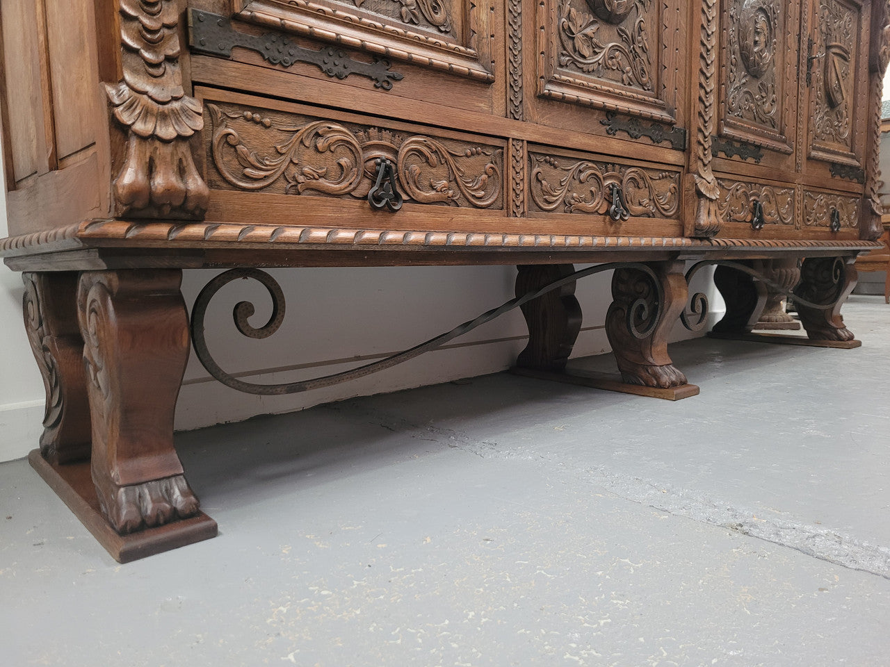 Large French Oak Renaissance style four door sideboard/buffet. Great decorative item with amazing carvings and stunning iron work on base. It is in good original detailed condition. Can pull apart completely making it easier to move.