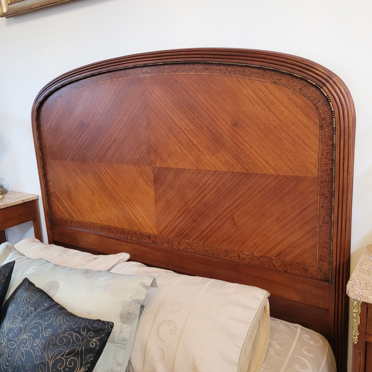 This elegant French Art Deco Walnut & Burr Walnut queen-size bed showcases stunning bronze mounts and impeccable craftsmanship. Its custom-made slats ensure a comfortable and supportive rest, while the ease of assembly and disassembly adds to its practicality. Sourced directly from France, it has been detailed and is in good condition.