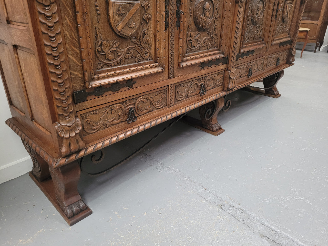 Large French Oak Renaissance style four door sideboard/buffet. Great decorative item with amazing carvings and stunning iron work on base. It is in good original detailed condition. Can pull apart completely making it easier to move.