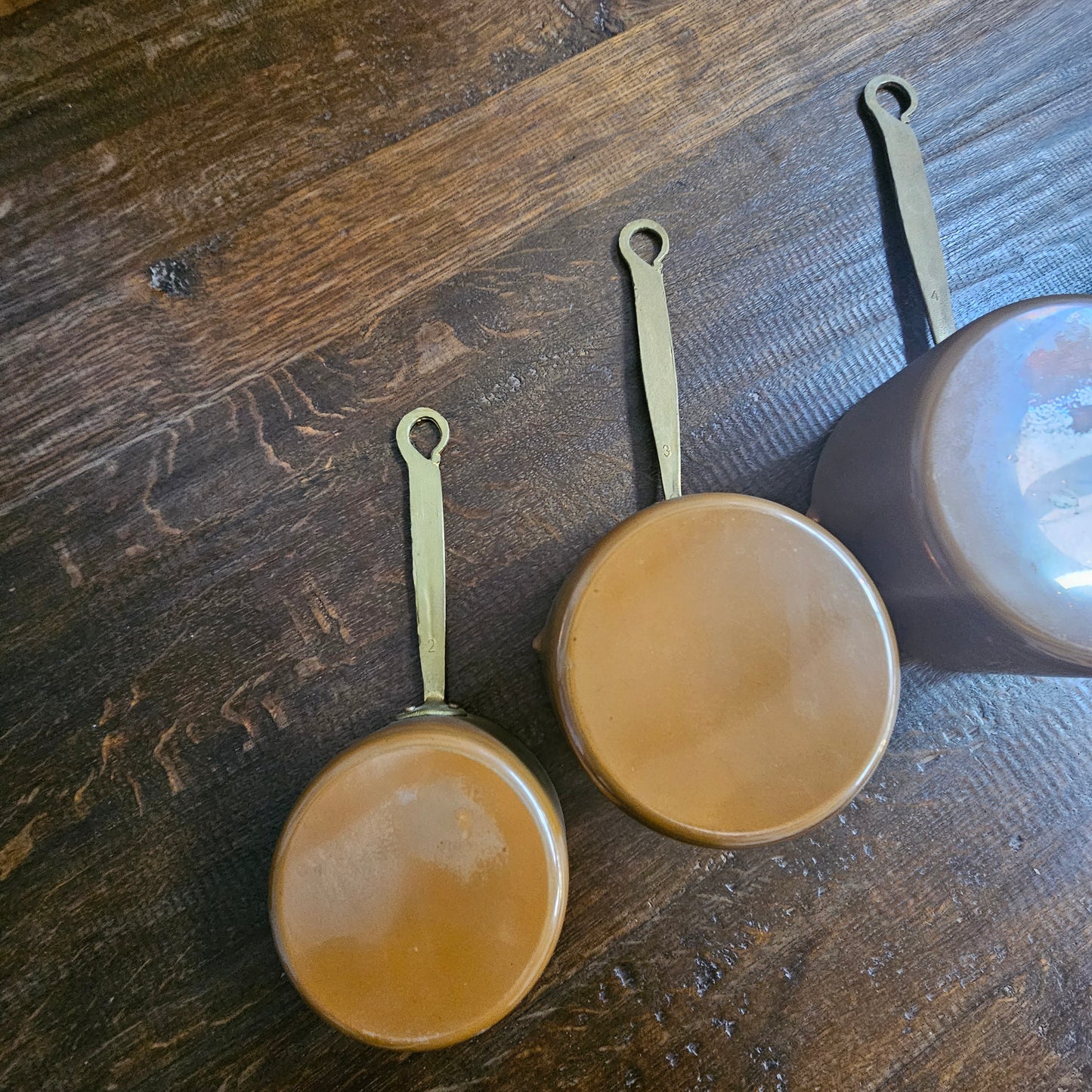 Amazing set of five sauce pots with spouts, lovely handles. They are in good original condition and have been sourced from France