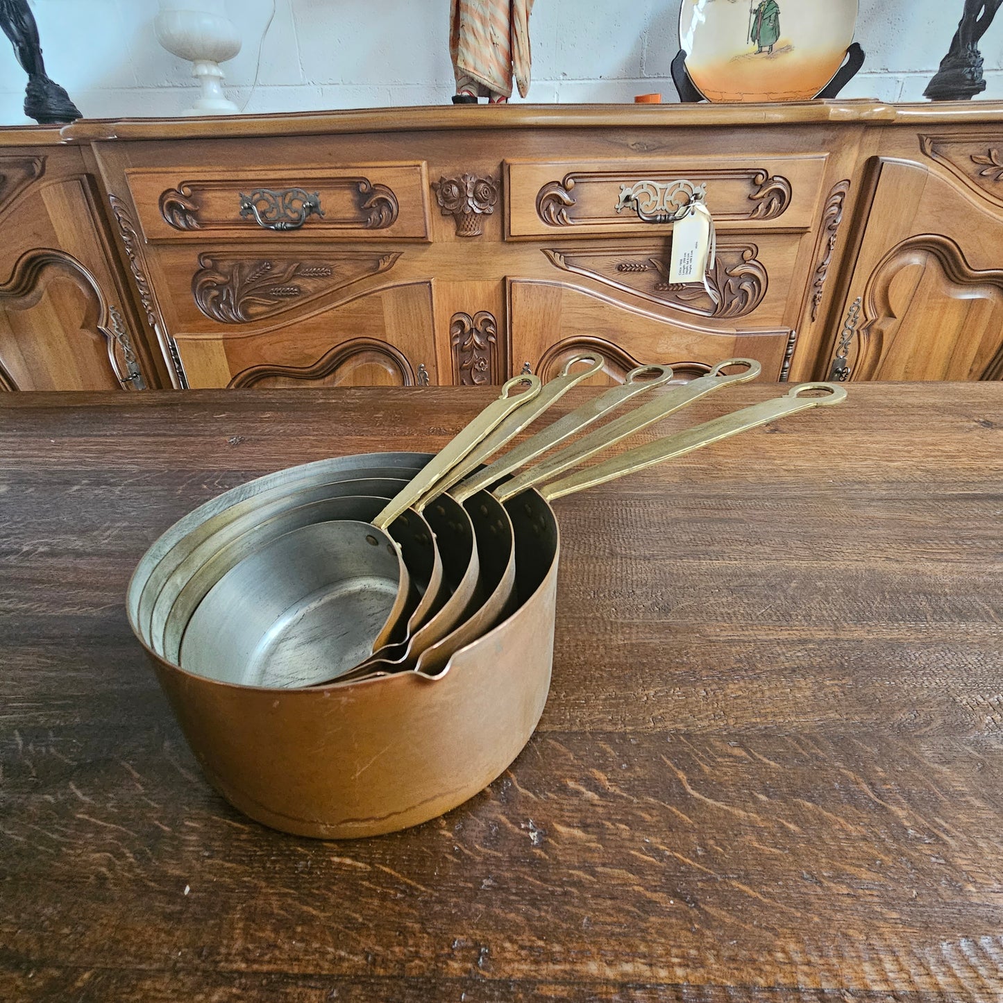 Amazing set of five sauce pots with spouts, lovely handles. They are in good original condition and have been sourced from France