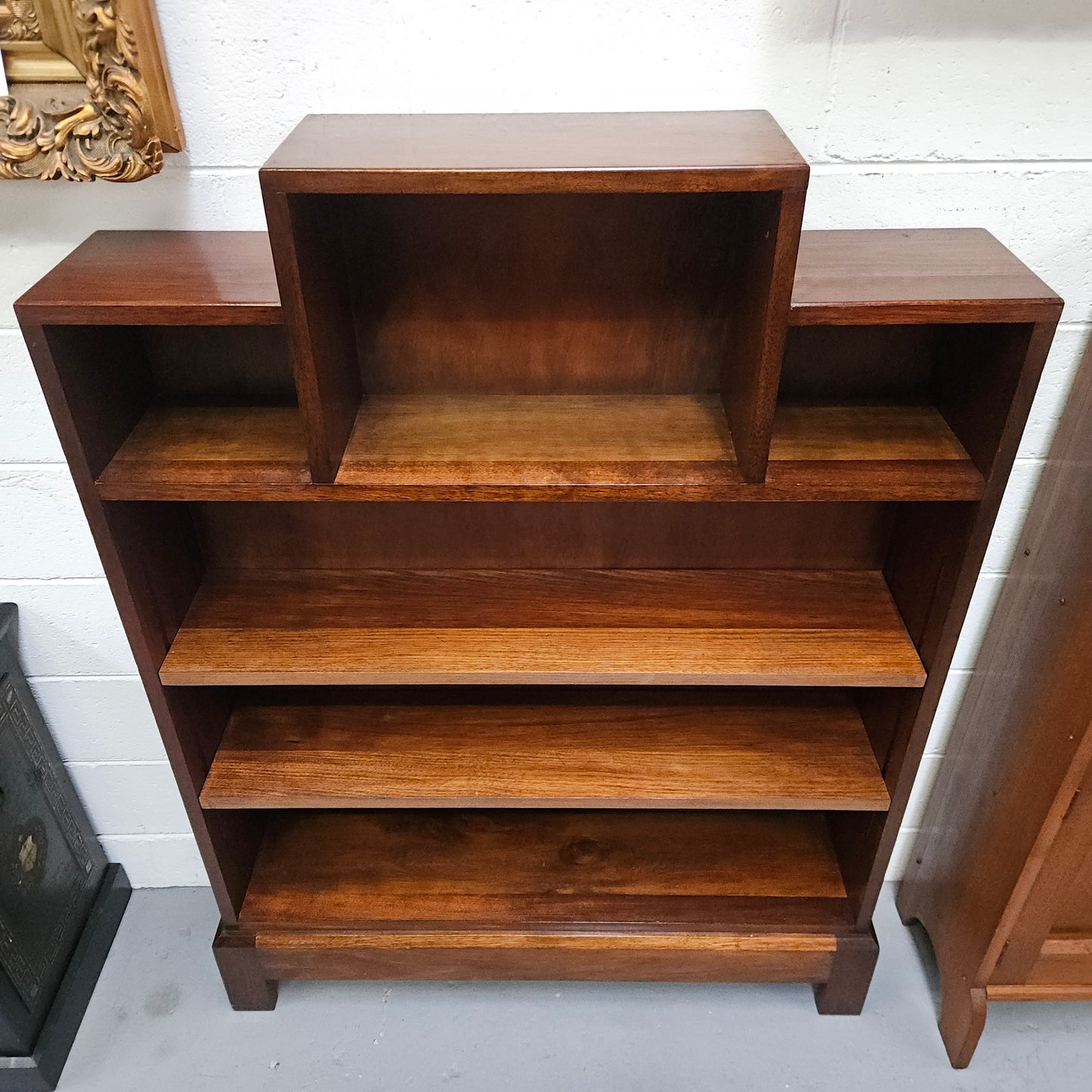 Australian blackwood Arts and Crafts bookcase with two fully adjustable shelves. It has been sourced locally. Made with solid Australian blackwood, this Arts and Crafts bookcase boasts two fully adjustable shelves for versatile storage options. Its good original detail adds a touch of character and charm.