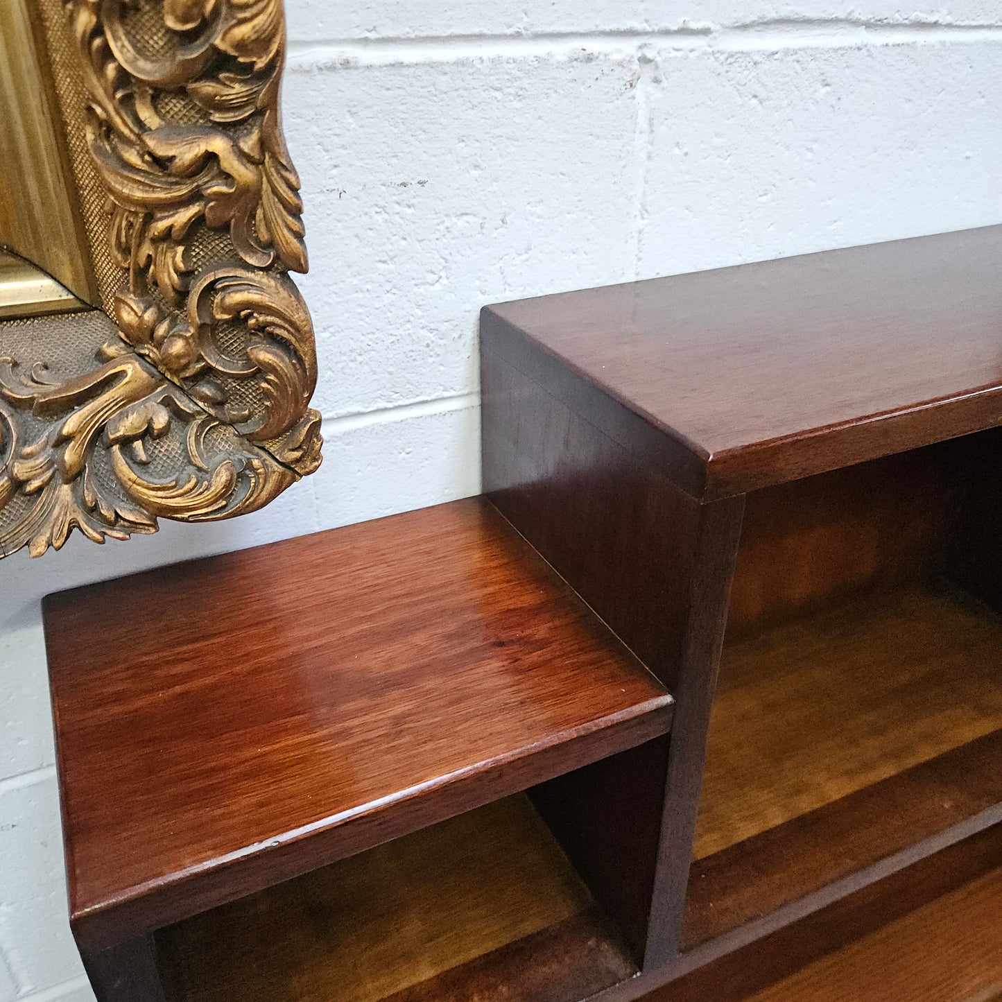 Australian blackwood Arts and Crafts bookcase with two fully adjustable shelves. It has been sourced locally. Made with solid Australian blackwood, this Arts and Crafts bookcase boasts two fully adjustable shelves for versatile storage options. Its good original detail adds a touch of character and charm.