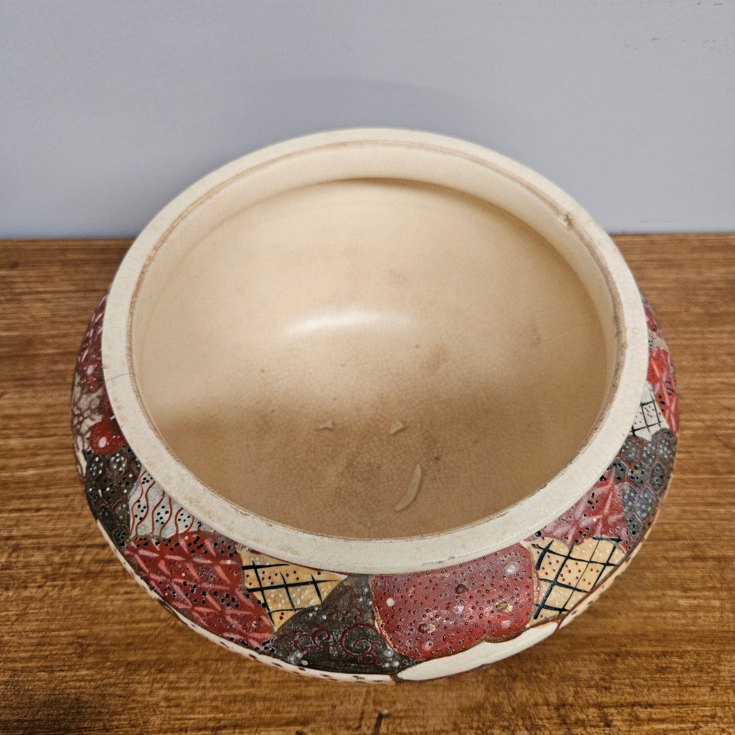 Antique Satsuma hand painted jardinière pot. It is signed and has some crazing. In good condition.