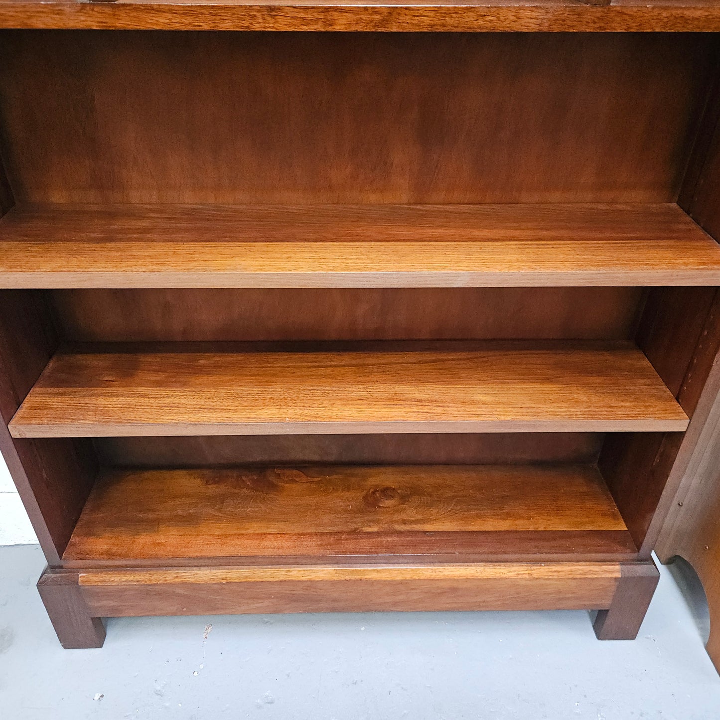 Australian blackwood Arts and Crafts bookcase with two fully adjustable shelves. It has been sourced locally. Made with solid Australian blackwood, this Arts and Crafts bookcase boasts two fully adjustable shelves for versatile storage options. Its good original detail adds a touch of character and charm.