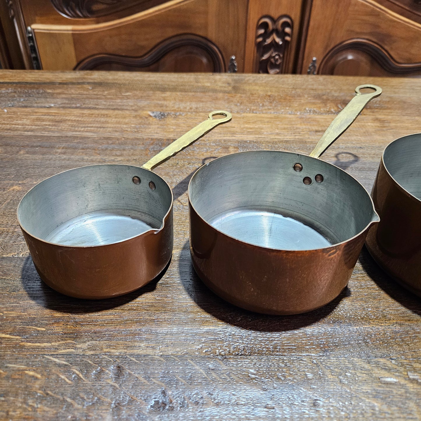 Amazing set of five sauce pots with spouts, lovely handles. They are in good original condition and have been sourced from France