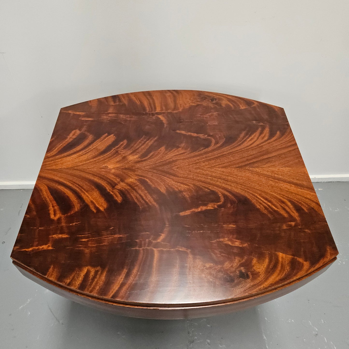 French Art Deco flame mahogany center table. Sourced directly from France it is in good original detailed condition. Circa 1930's