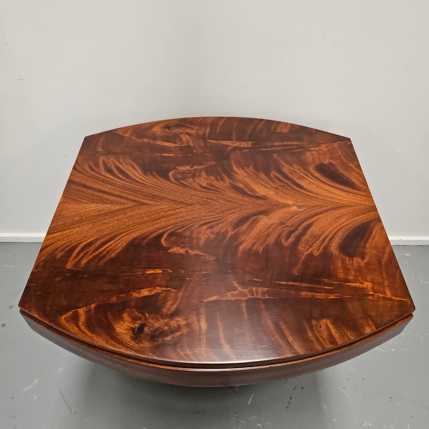 French Art Deco flame mahogany center table. Sourced directly from France it is in good original detailed condition. Circa 1930's