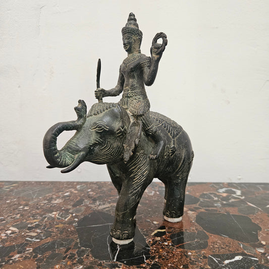 Heavy Vintage Bronze elephant with God riding on top. It has beautiful details and is in good original condition with signs on age.