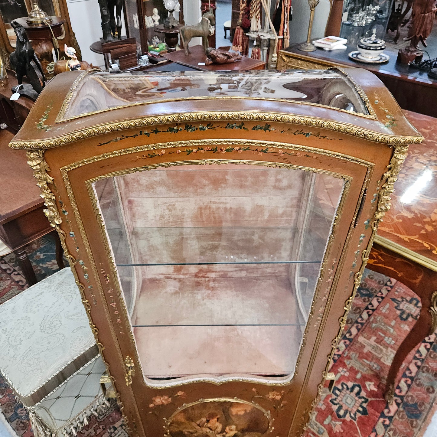 Stunning Rare 19th Century French Salon style vitrine/display cabinet. It has beautifully hand-painted panels and decoration all over with the original two glass shelves inside. It is circa 1900. In very good restored condition.