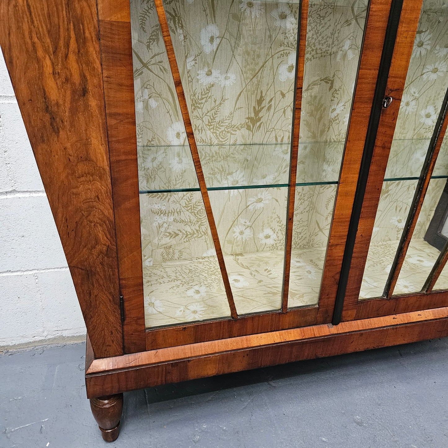 Stunning Art Deco display cabinet with two glass shelfs, Walnut and lockable glass doors. This cabinet is in great original condition for the age.