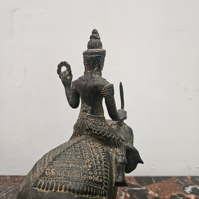 Heavy Vintage Bronze elephant with God riding on top. It has beautiful details and is in good original condition with signs on age.