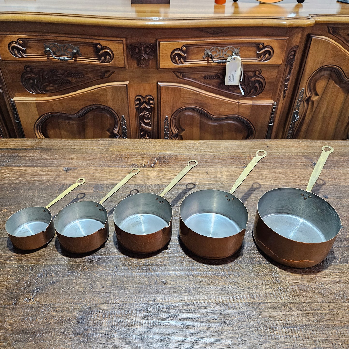 Amazing set of five sauce pots with spouts, lovely handles. They are in good original condition and have been sourced from France