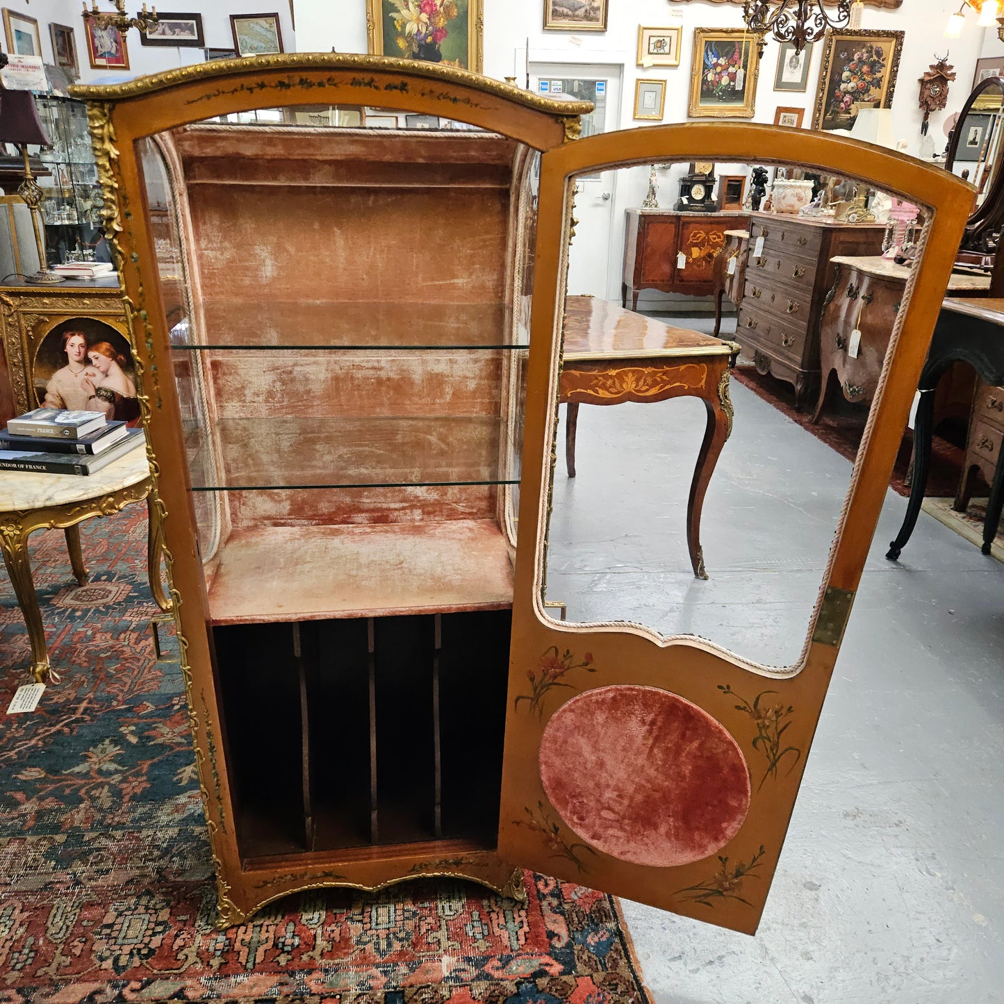 Stunning Rare 19th Century French Salon style vitrine/display cabinet. It has beautifully hand-painted panels and decoration all over with the original two glass shelves inside. It is circa 1900. In very good restored condition.