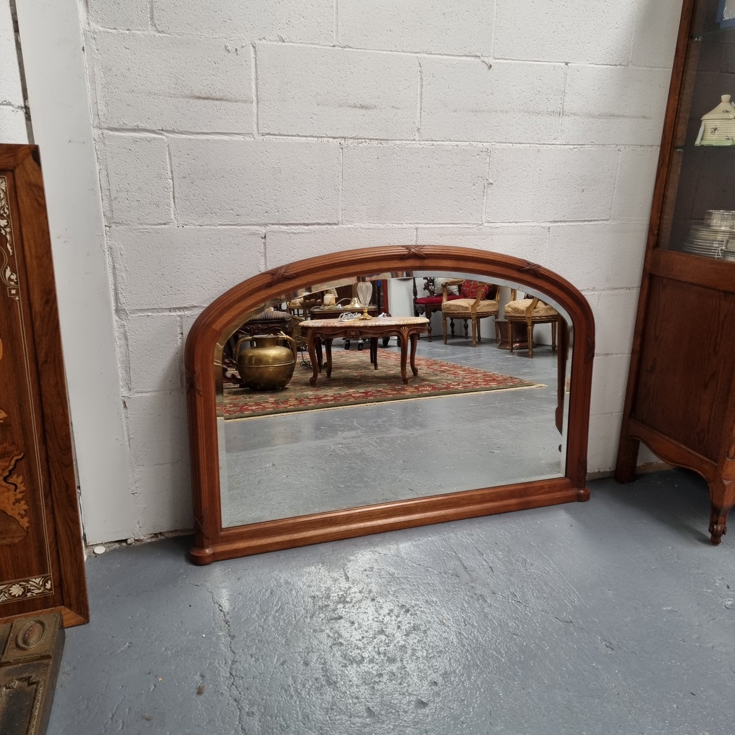 French walnut Art Deco style mantle mirror. Beautiful decorative carvings and still has its original bevelled edge mirror. Sourced directly from France and in good original condition with mirror showing some age.