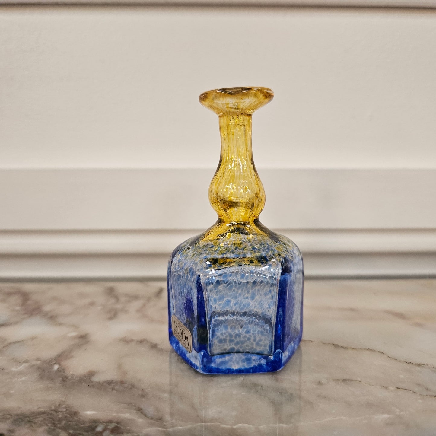 Beautiful yellow and blue Kosta Boda bud vase, with its original sticker. Please view photos as they help form part of the description.