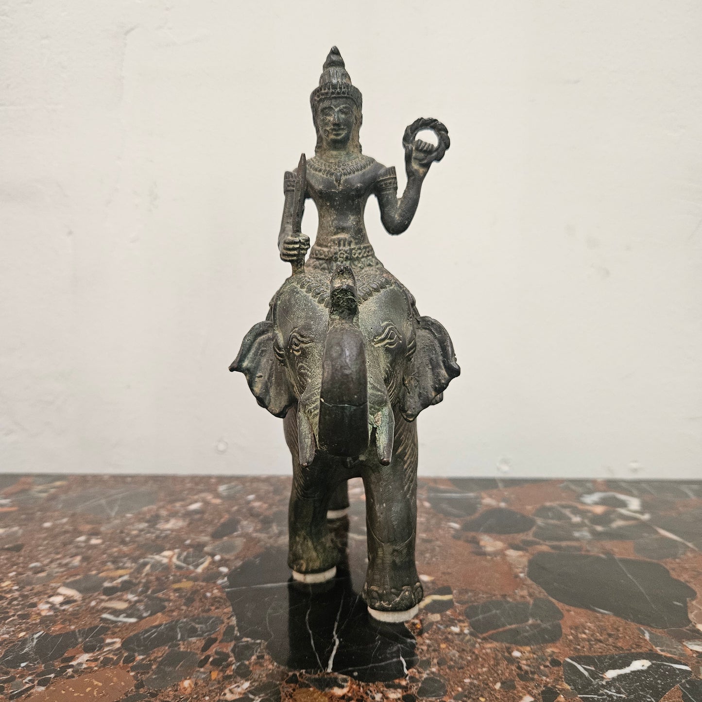 Heavy Vintage Bronze elephant with God riding on top. It has beautiful details and is in good original condition with signs on age.