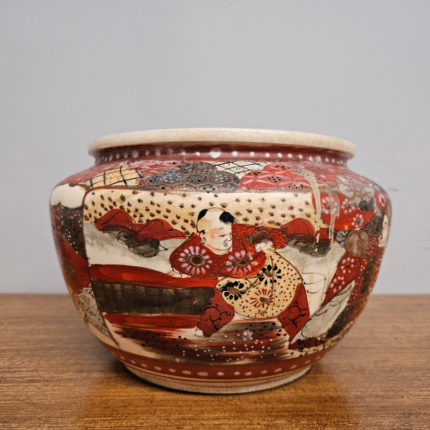 Antique Satsuma hand painted jardinière pot. It is signed and has some crazing. In good condition.