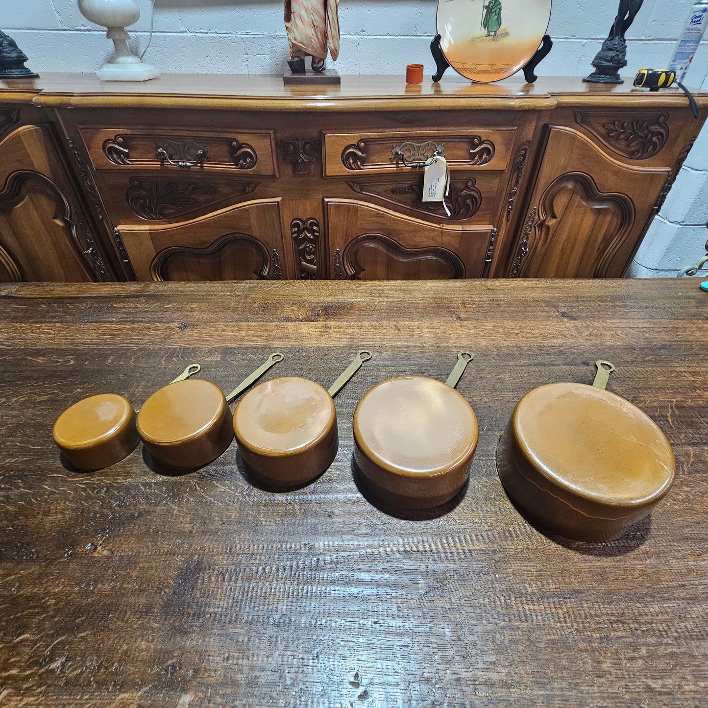 Amazing set of five sauce pots with spouts, lovely handles. They are in good original condition and have been sourced from France
