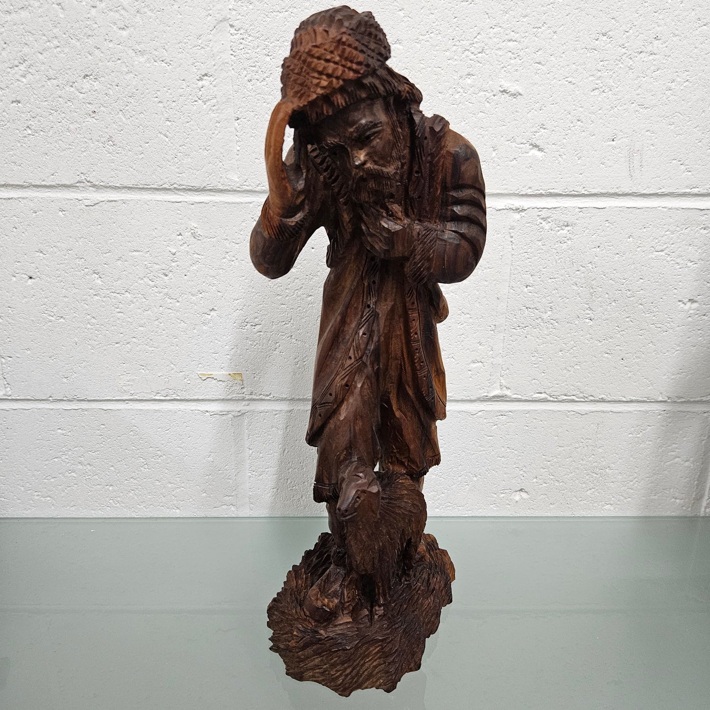 Impressive wooden craving of a Shepard and a goat, it is in good original condition.