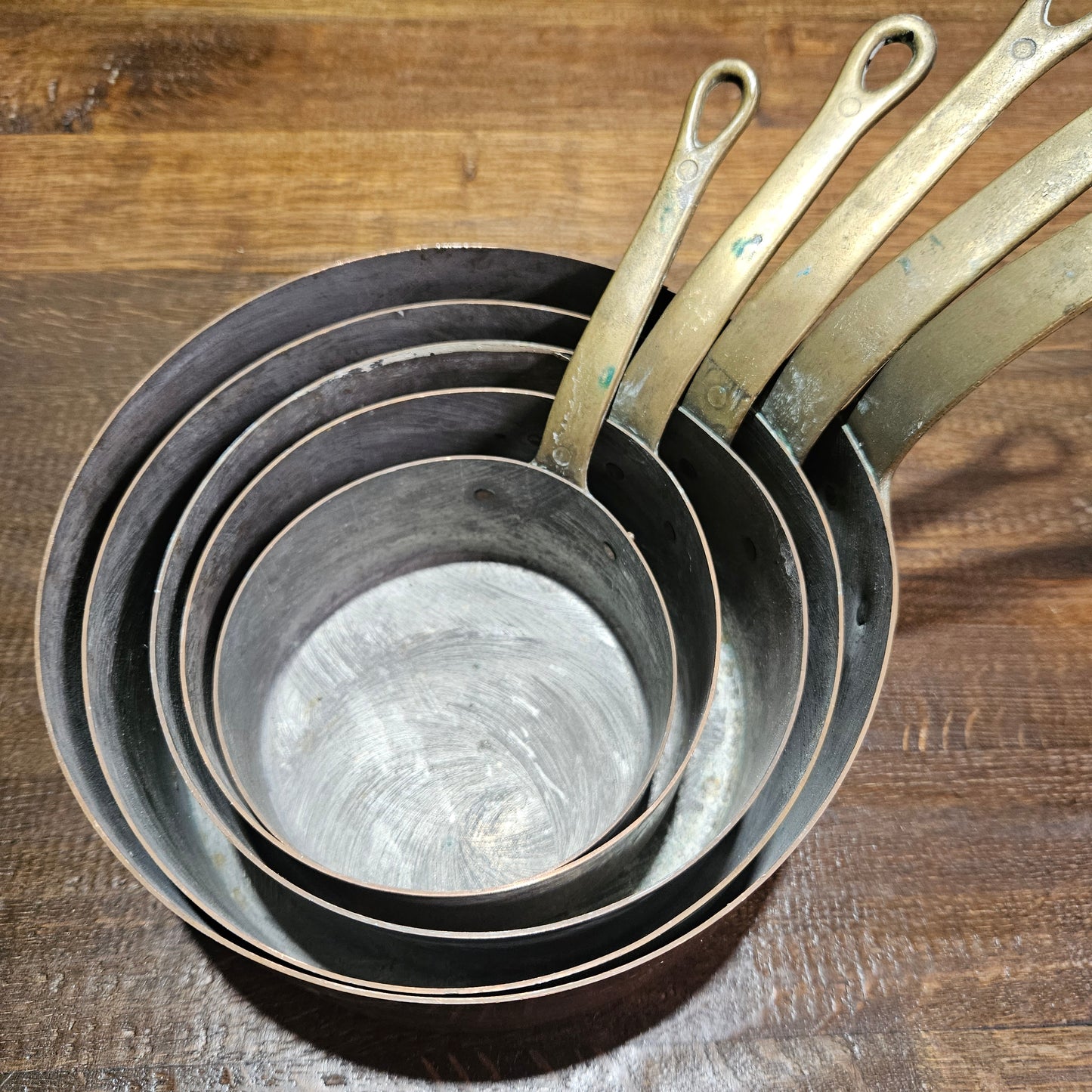 Lovely set of five copper sauce pots, they are all in good original condition for the age. Sourced from France.