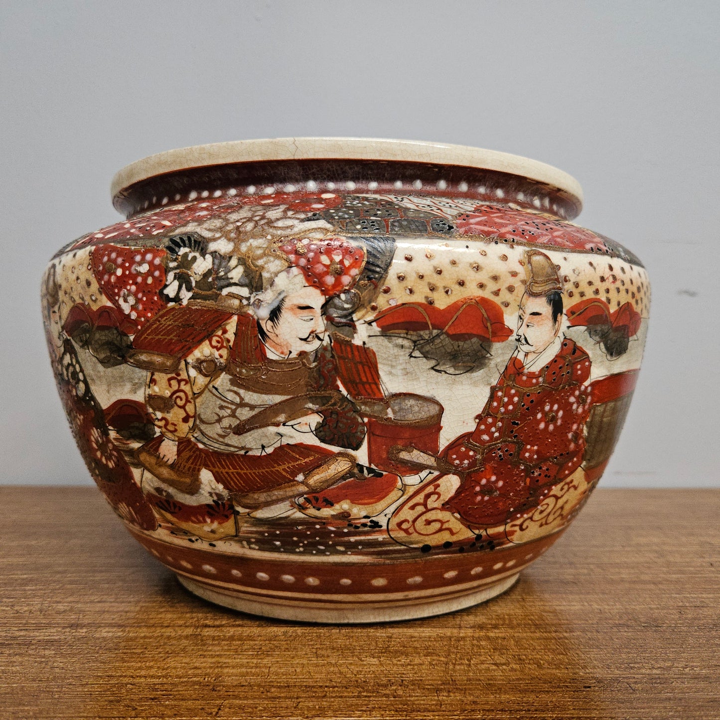 Antique Satsuma hand painted jardinière pot. It is signed and has some crazing. In good condition.