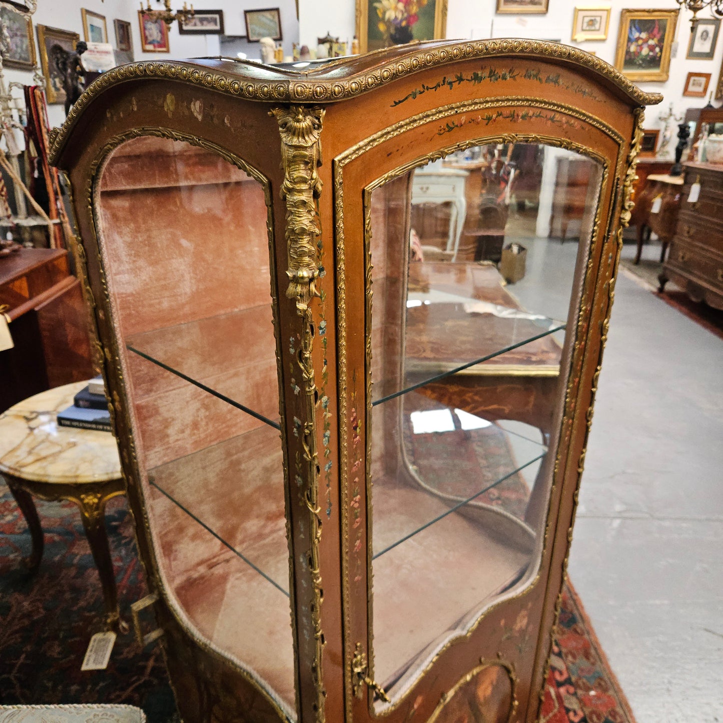 Stunning Rare 19th Century French Salon style vitrine/display cabinet. It has beautifully hand-painted panels and decoration all over with the original two glass shelves inside. It is circa 1900. In very good restored condition.