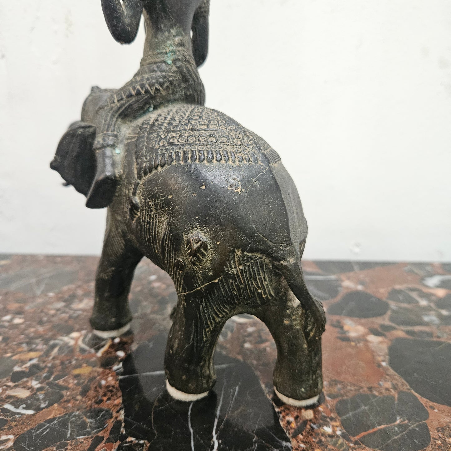 Heavy Vintage Bronze elephant with God riding on top. It has beautiful details and is in good original condition with signs on age.