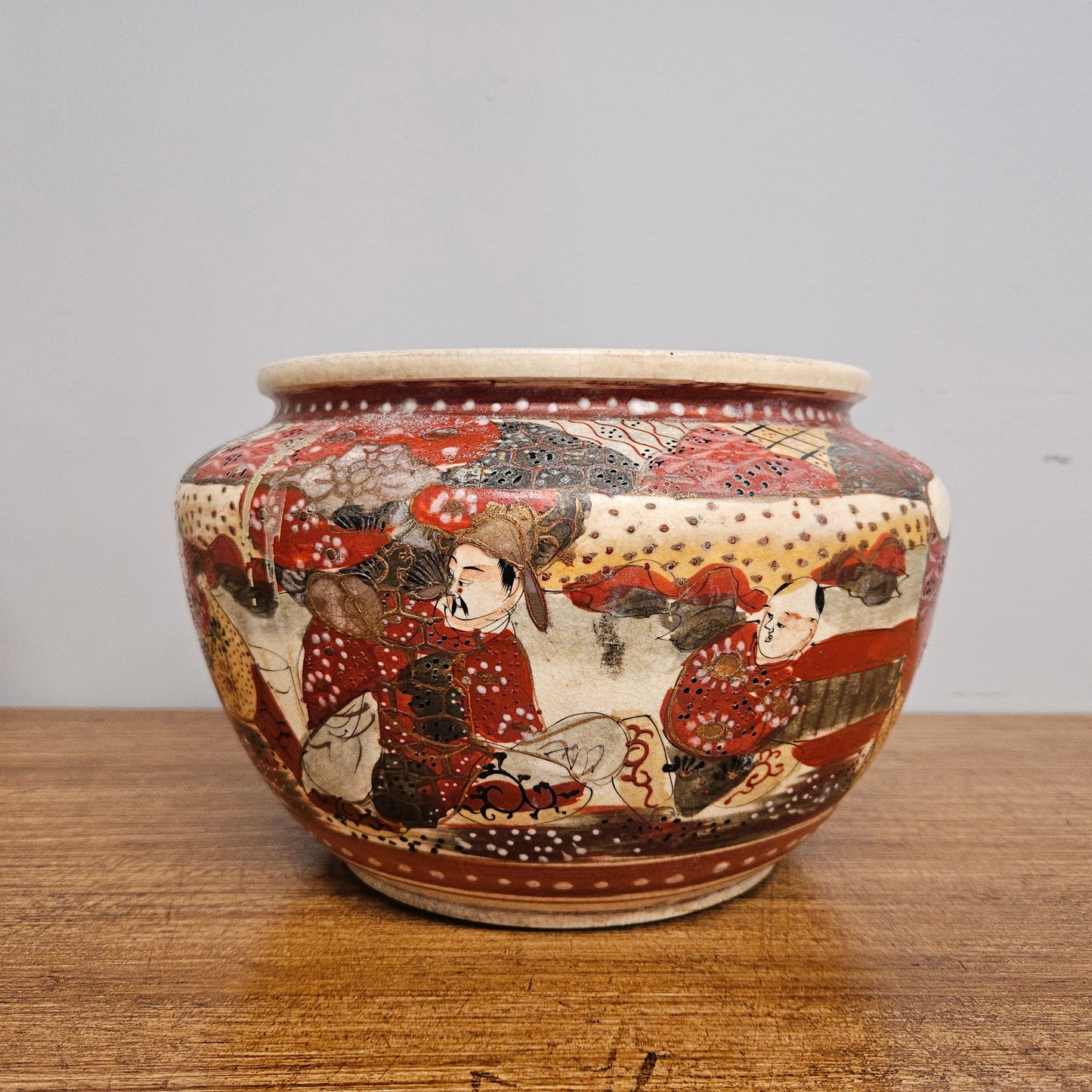 Antique Satsuma hand painted jardinière pot. It is signed and has some crazing. In good condition.