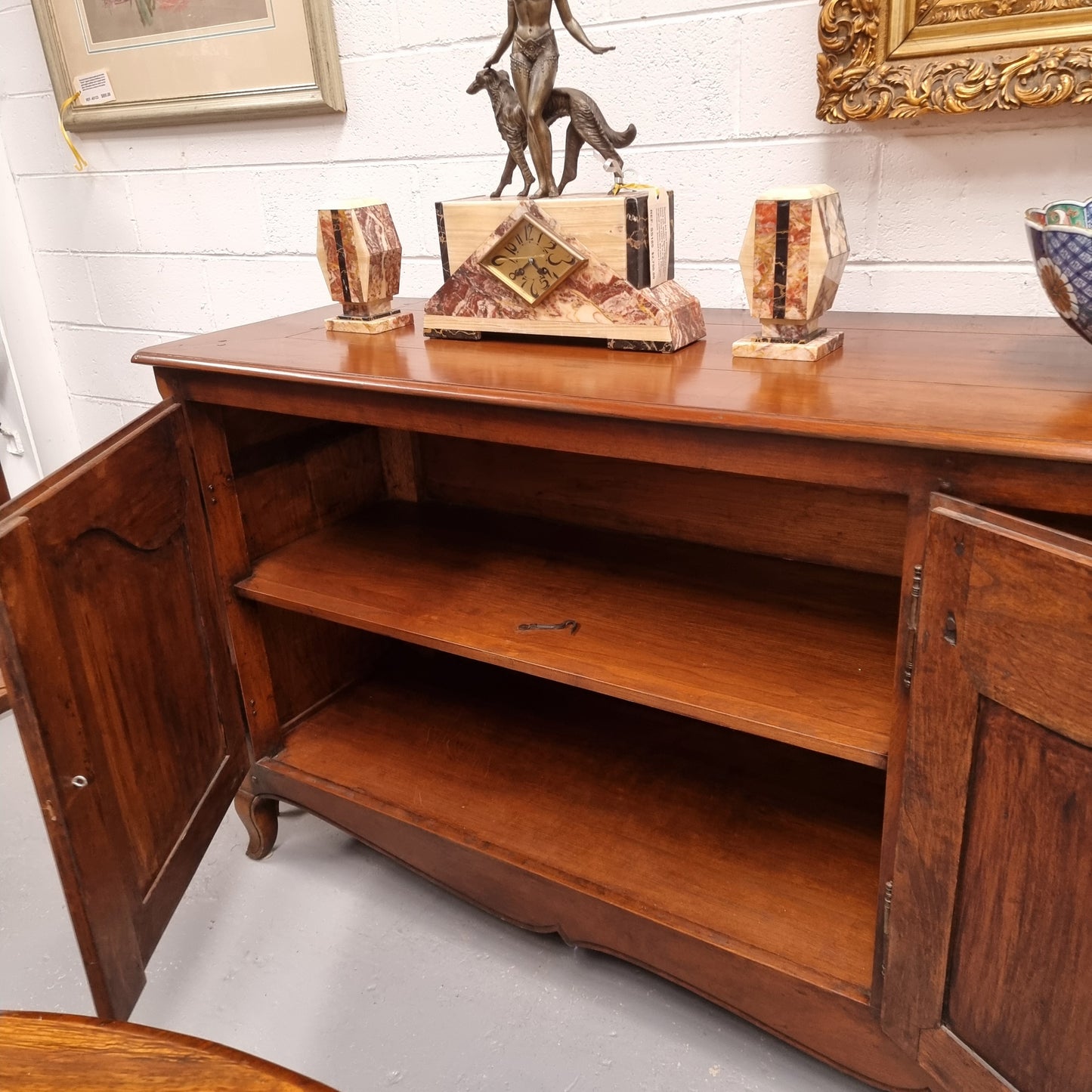 Magnificent Vintage French high quality custom made five door sideboard. Heaps of pure storage with not only the cupboard storage but it also has fours drawers on one side and plenty of display space on top. This amazing sideboard is sure to make any room grand. It is in good original condition.