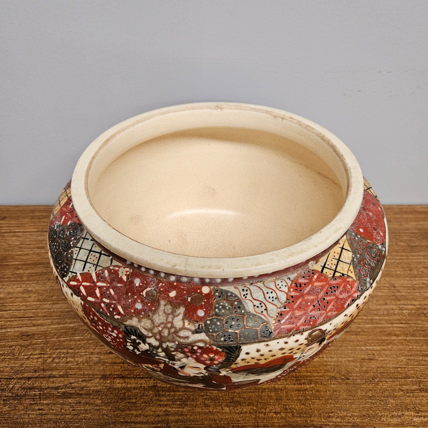 Antique Satsuma hand painted jardinière pot. It is signed and has some crazing. In good condition.