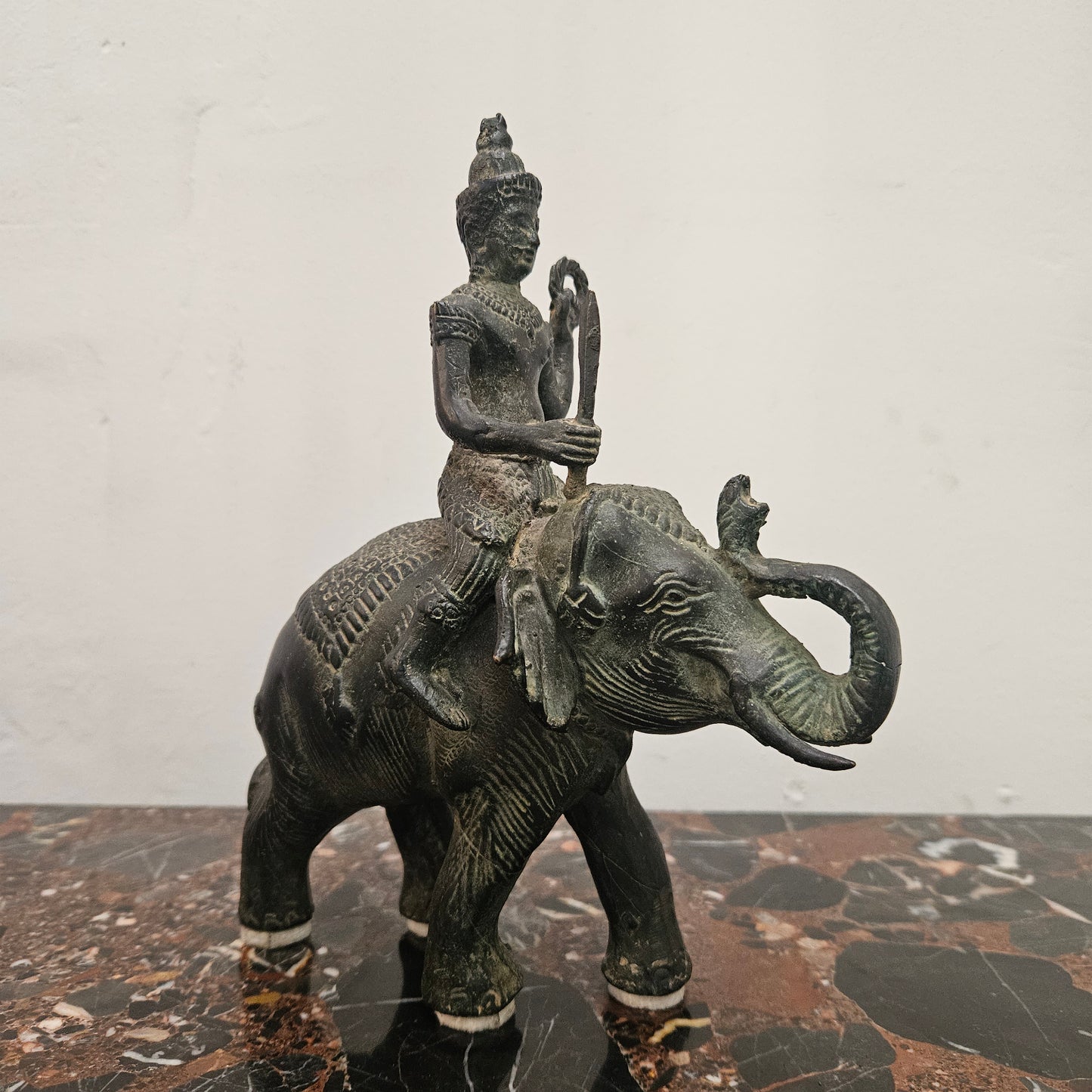 Heavy Vintage Bronze elephant with God riding on top. It has beautiful details and is in good original condition with signs on age.