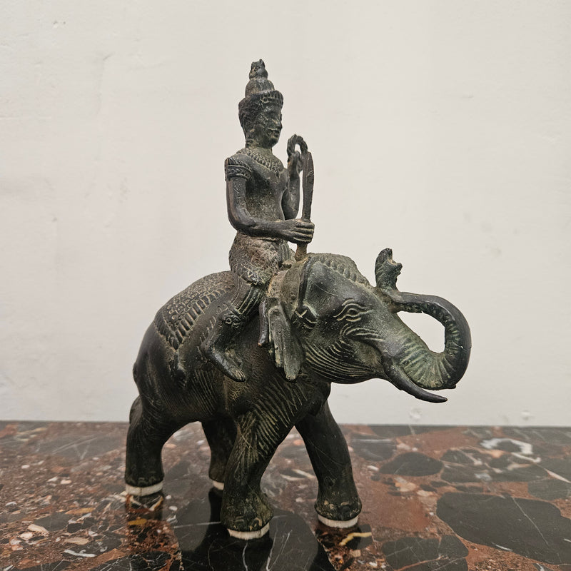 Heavy Vintage Bronze elephant with God riding on top. It has beautiful details and is in good original condition with signs on age.