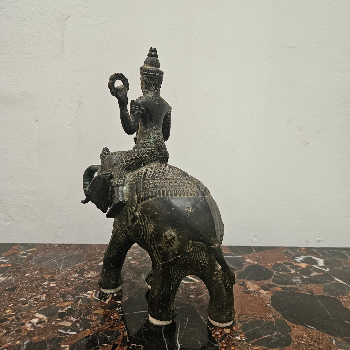 Heavy Vintage Bronze elephant with God riding on top. It has beautiful details and is in good original condition with signs on age.