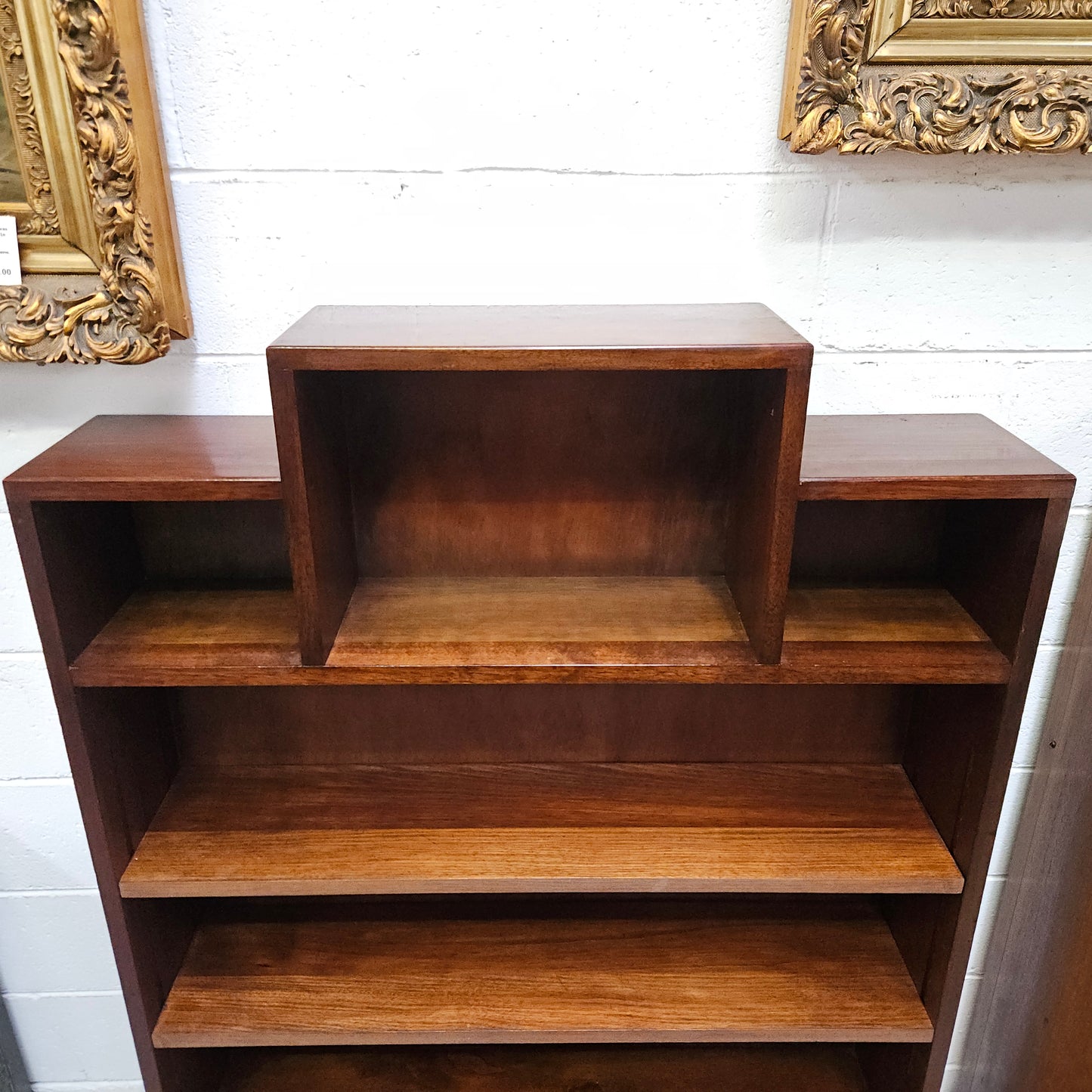 Australian blackwood Arts and Crafts bookcase with two fully adjustable shelves. It has been sourced locally. Made with solid Australian blackwood, this Arts and Crafts bookcase boasts two fully adjustable shelves for versatile storage options. Its good original detail adds a touch of character and charm.